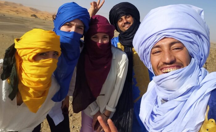 Merzouga Sahara desert camel trek Erg Chebbi dunes Morocco sunset tour
