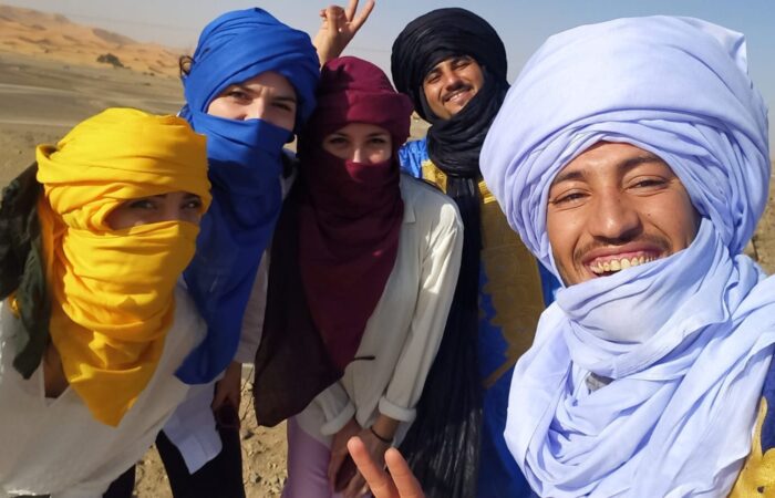 Merzouga Sahara desert camel trek Erg Chebbi dunes Morocco sunset tour