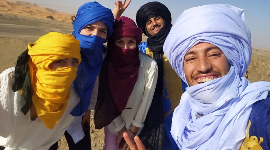 Merzouga Sahara desert camel trek Erg Chebbi dunes Morocco sunset tour