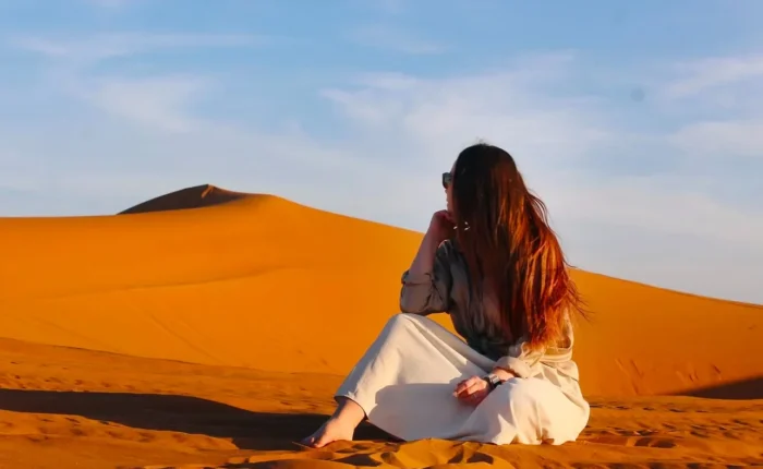 Merzouga Sahara desert camel trek Erg Chebbi dunes Morocco sunset