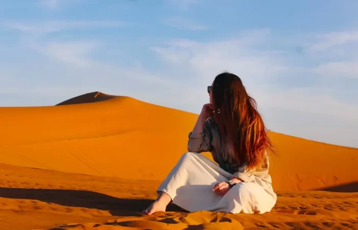 Merzouga Sahara desert camel trek Erg Chebbi dunes Morocco sunset