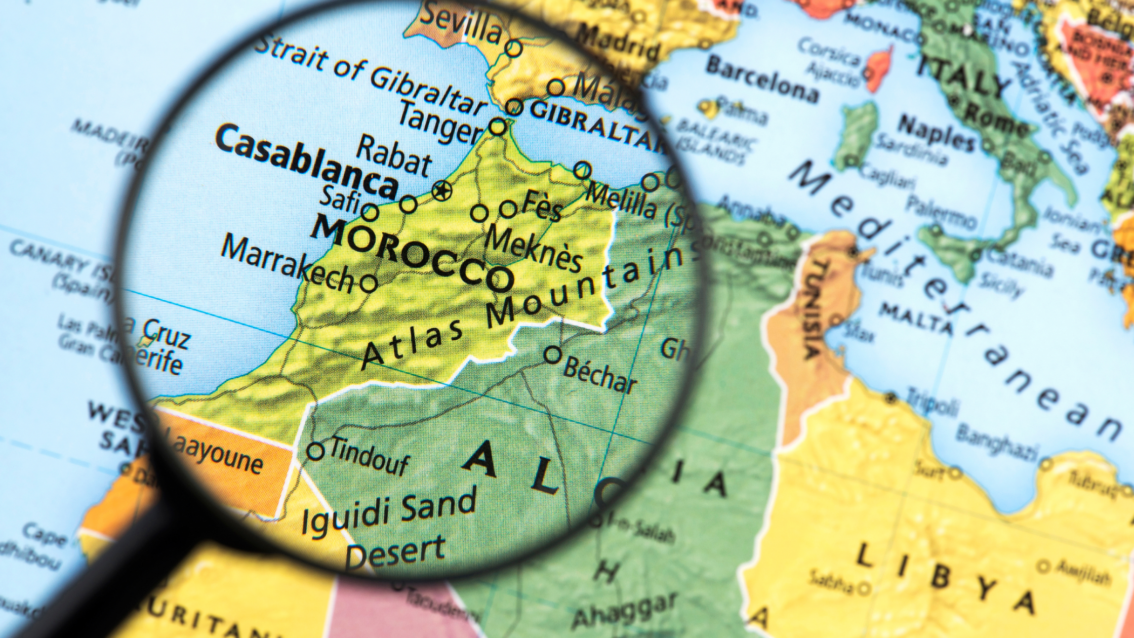 Where is Morocco? Beautiful view of Morocco featuring the Atlas Mountains, Sahara Desert, and historic cities.